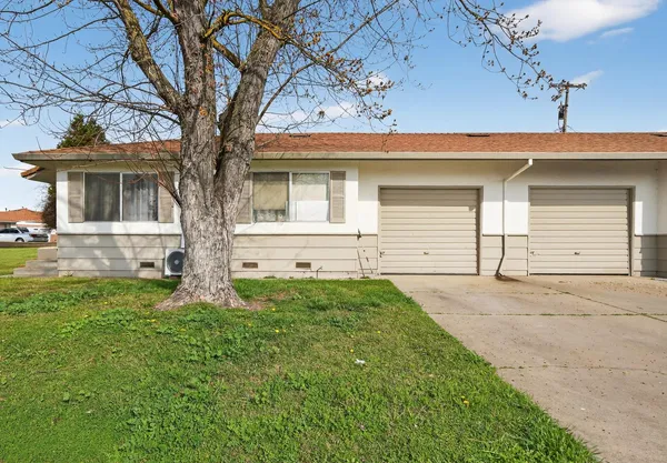 front view of a house with a yard