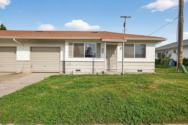 a front view of house with yard
