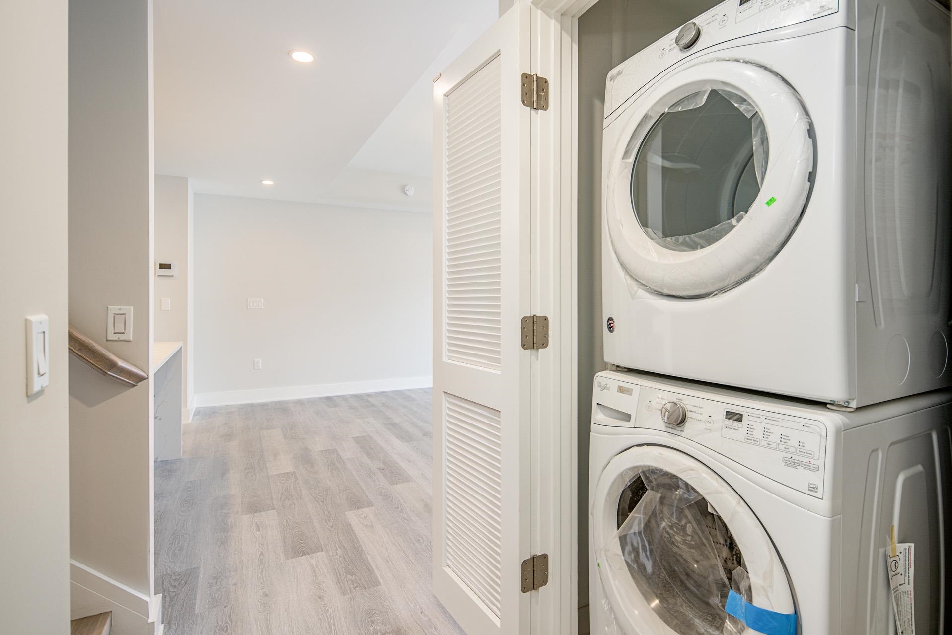 527 Monroe Street, Unit 3R Hoboken, NJ 07030 - Photo 11 of 22 a view of a hallway with washer and dryer