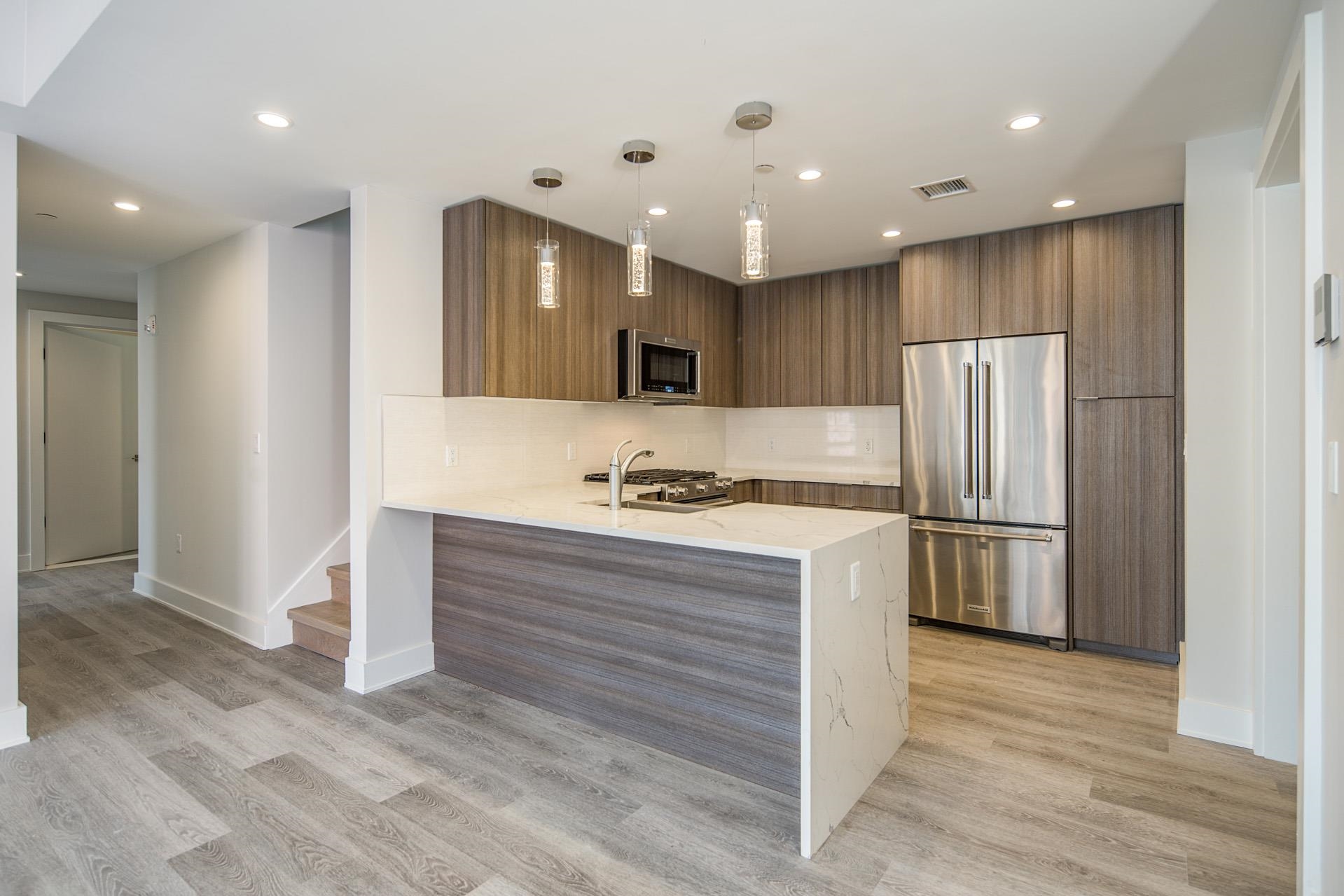 527 Monroe Street, Unit 3R Hoboken, NJ 07030 - Photo 3 of 22 a kitchen with stainless steel appliances granite countertop a refrigerator and a stove top oven