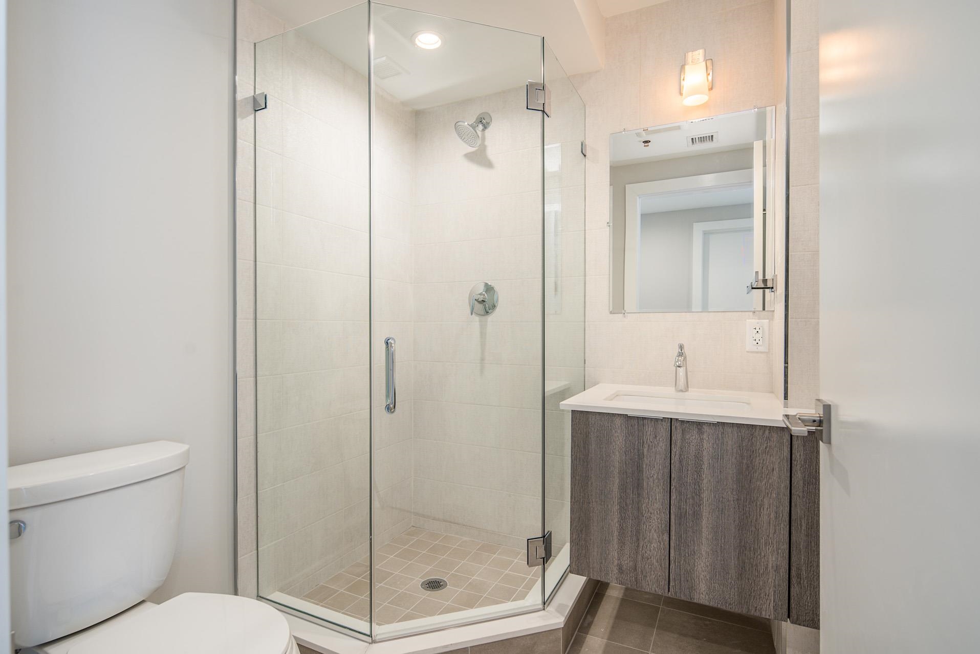 527 Monroe Street, Unit 3R Hoboken, NJ 07030 - Photo 10 of 22 a bathroom with a shower a toilet and sink