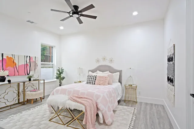 a kitchen with stainless steel appliances granite countertop a lot of counter space and wooden floor