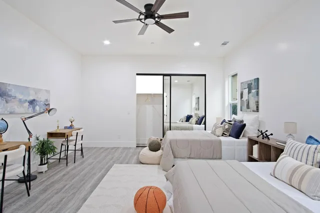 a view of living room filled with furniture and wooden floor