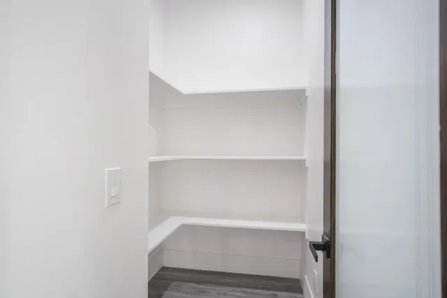 a bathroom with a double vanity sink and mirror with shower