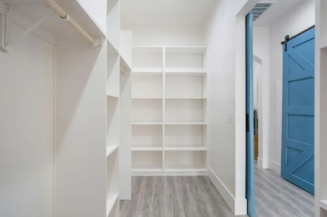 a front view of a house with a yard and balcony