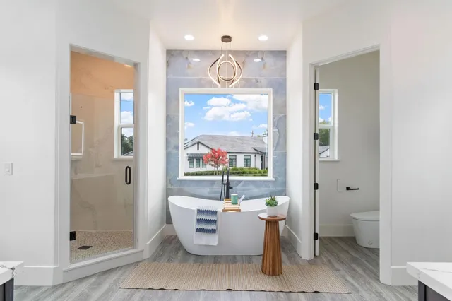 a living room with furniture and a large window with outer view