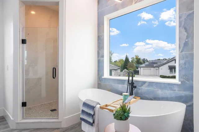 an aerial view of residential houses with outdoor space