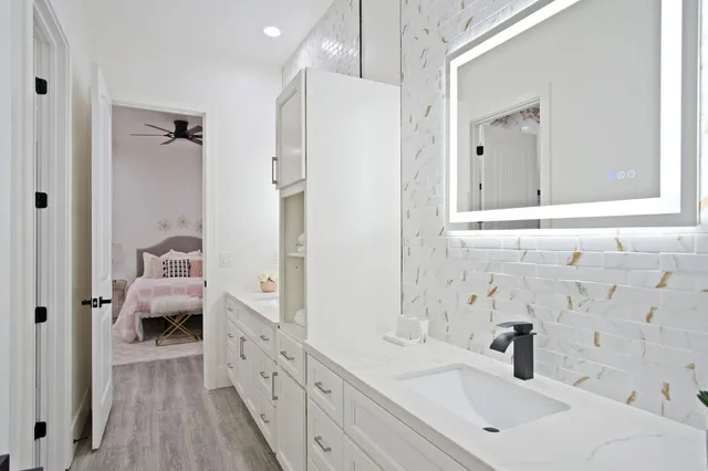 a view of a house with a backyard