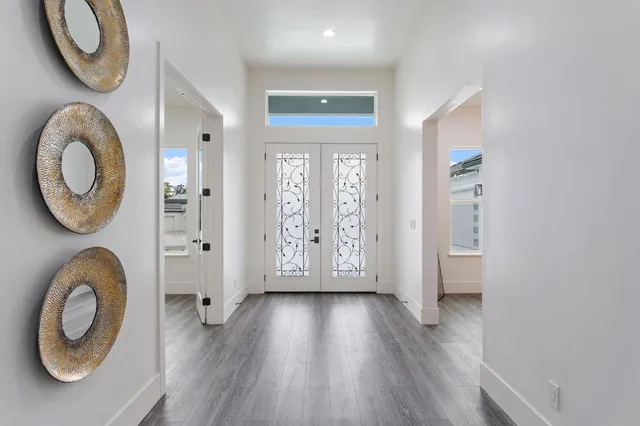 a bathroom with a sink mirror and shower