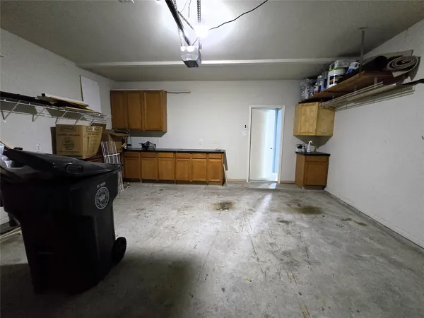 a kitchen with a refrigerator and a stove