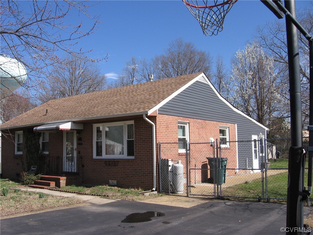 5415 Coxson Road Richmond, VA 23231 - Photo 2 of 14 a front view of a house with yard