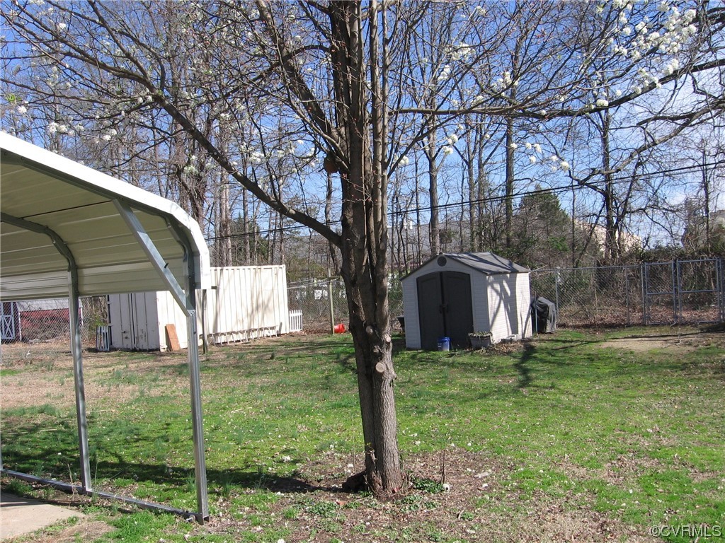 5415 Coxson Road Richmond, VA 23231 - Photo 6 of 14 a white house with a big yard and large trees