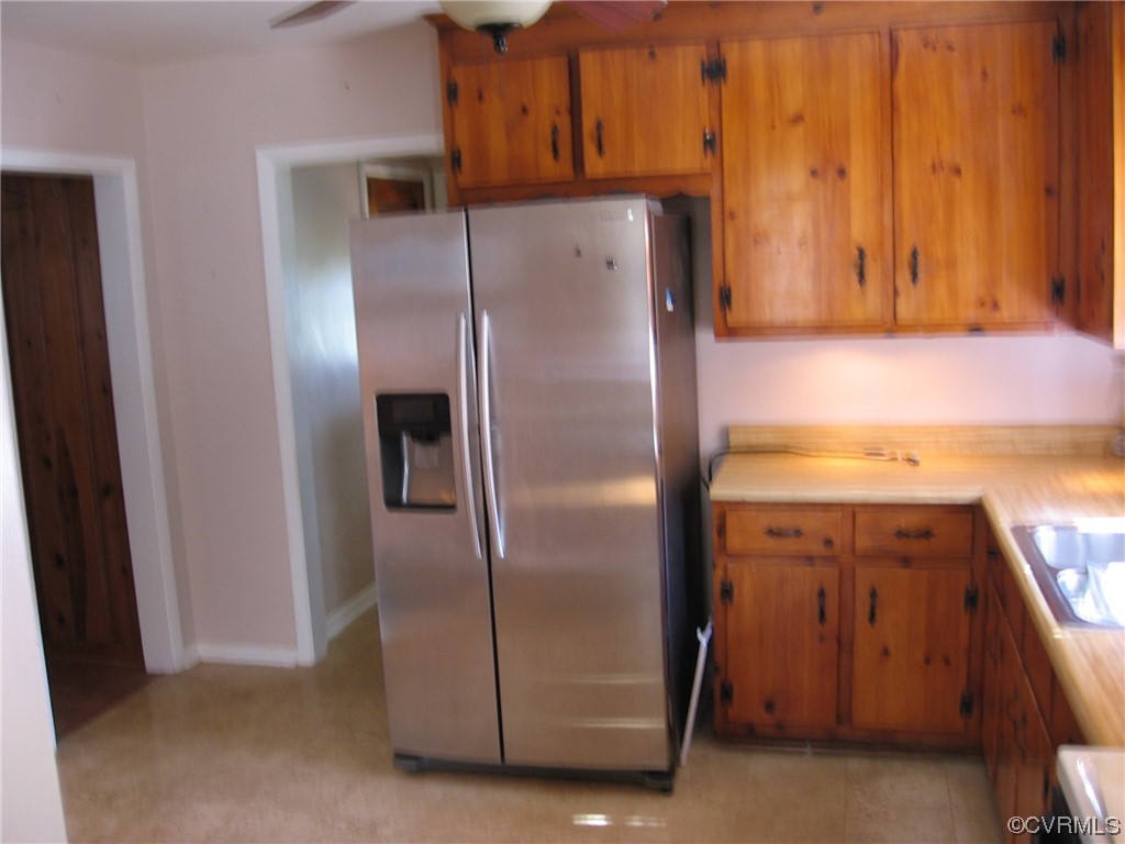 5415 Coxson Road Richmond, VA 23231 - Photo 7 of 14 a kitchen with metallic refrigerator freezer and a dishwasher