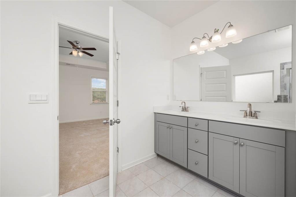 212 Umber Road Monticello, GA 31064 - Photo 12 of 30 a bathroom with a double vanity sink and mirror
