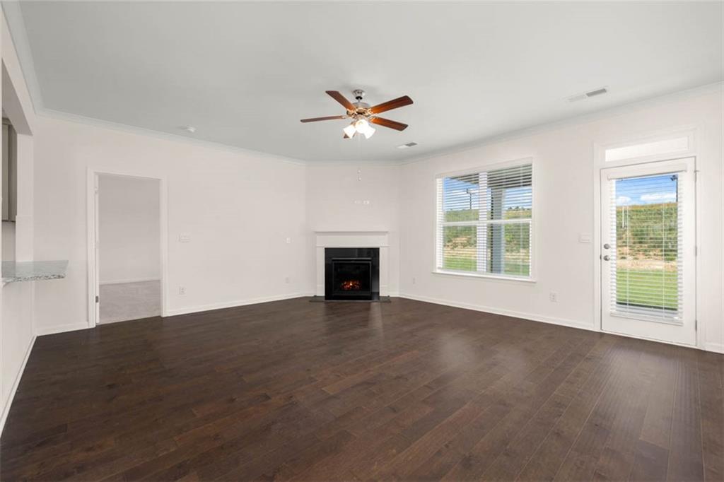 212 Umber Road Monticello, GA 31064 - Photo 15 of 30 an empty room with windows and fireplace