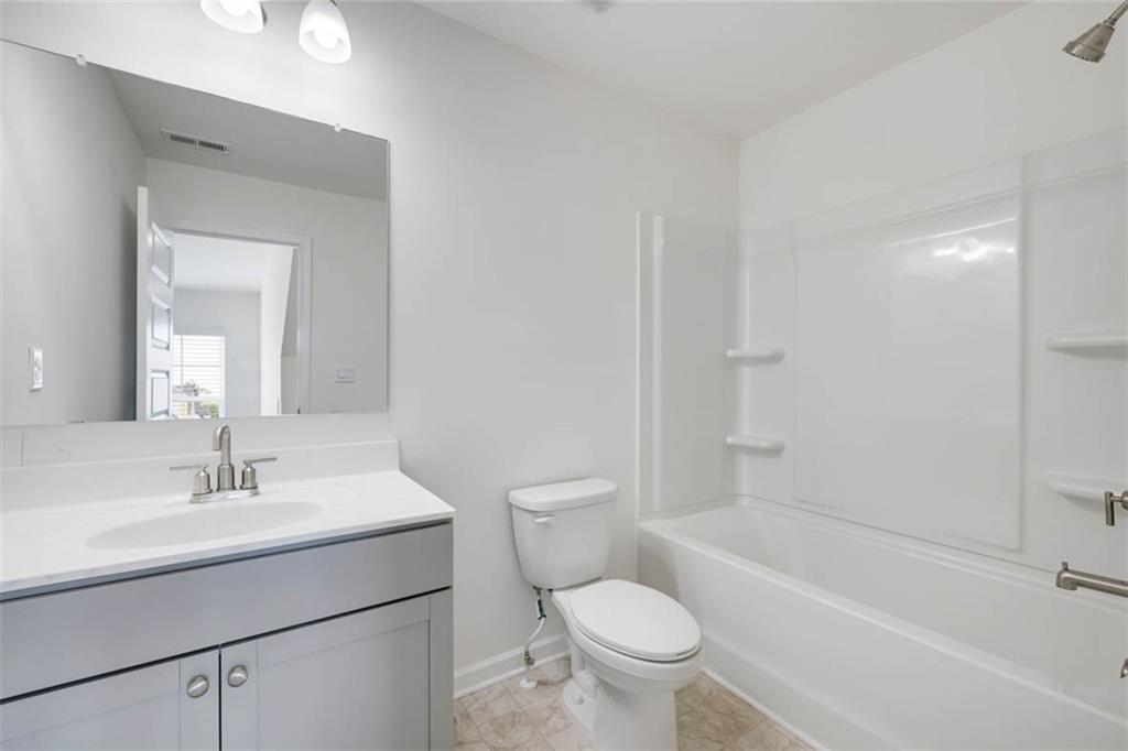 212 Umber Road Monticello, GA 31064 - Photo 26 of 30 a bathroom with a sink toilet and shower