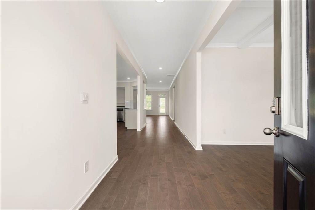 212 Umber Road Monticello, GA 31064 - Photo 3 of 30 a view of a hallway with wooden floor