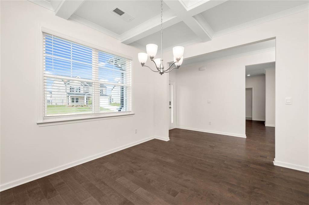 212 Umber Road Monticello, GA 31064 - Photo 5 of 30 a view of an empty room with wooden floor and a window