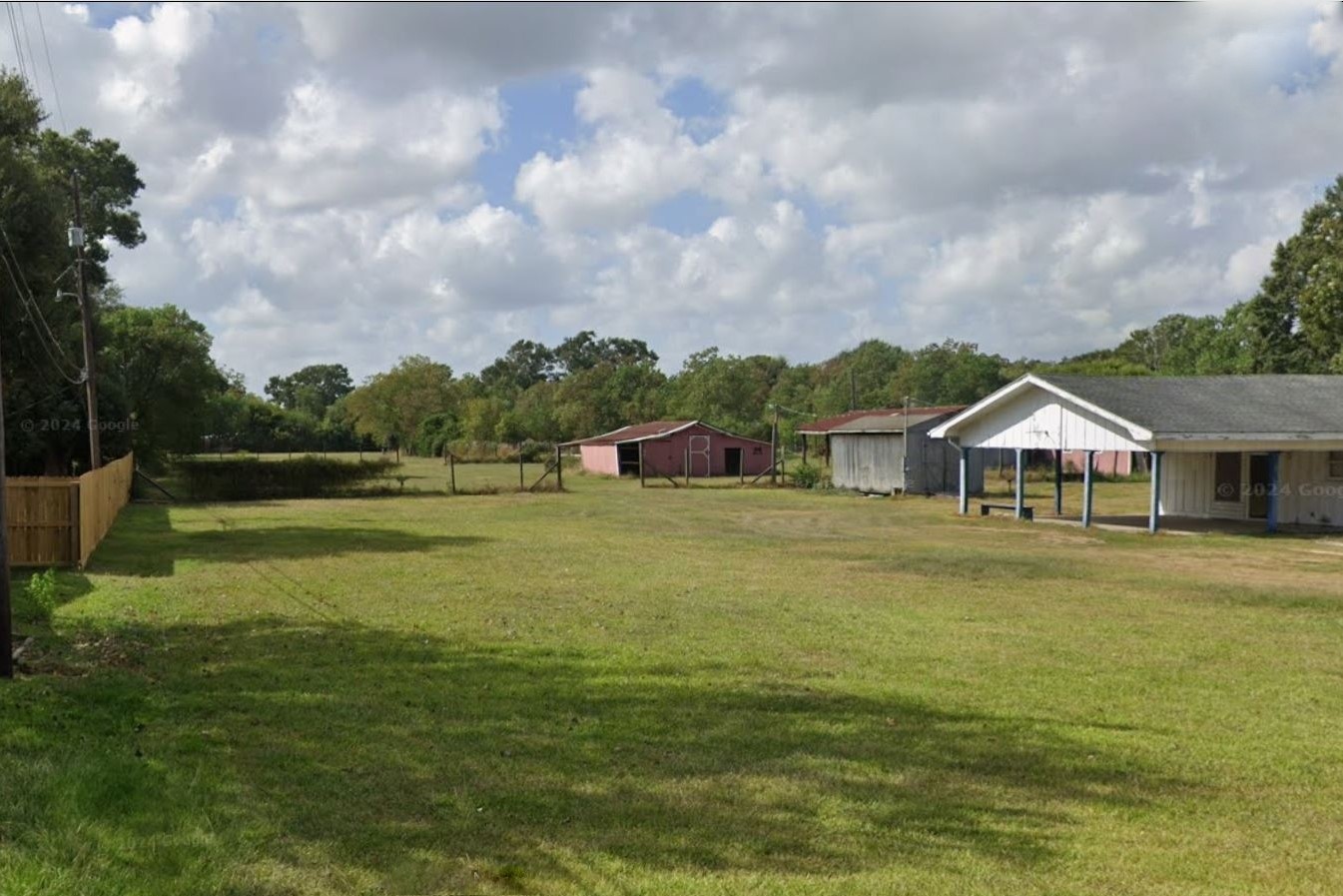 1420 South 29th Street Nederland, TX 77627 - Photo 2 of 19 a front view of a house with a big yard