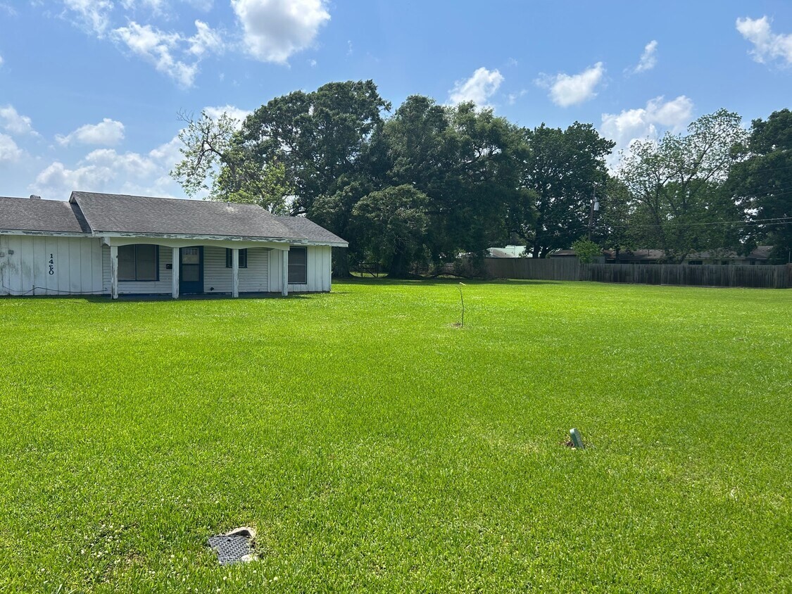 1420 South 29th Street Nederland, TX 77627 - Photo 7 of 19 a view of a house with a yard