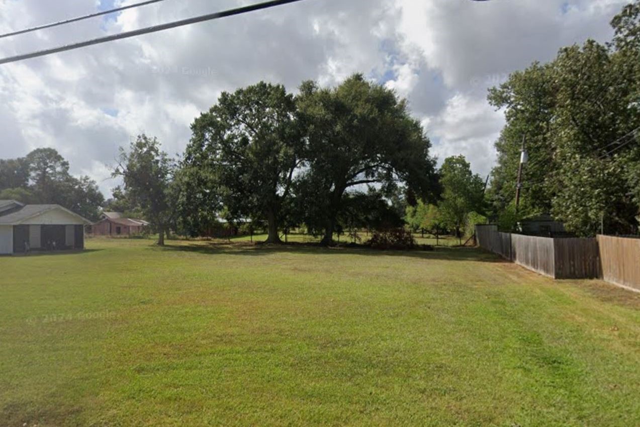 1420 South 29th Street Nederland, TX 77627 - Photo 8 of 19 a view of a swimming pool with an outdoor space and seating area