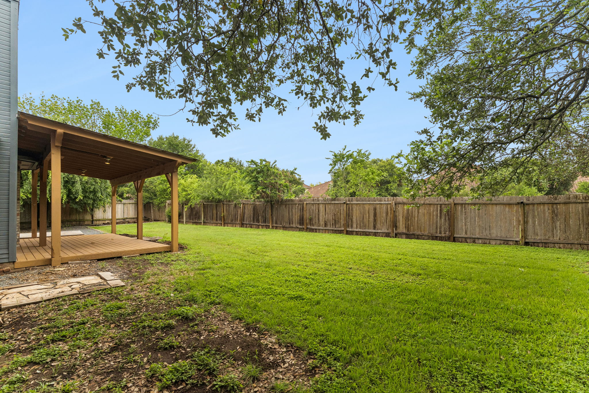 10400 O'Rourk Lane Austin, TX 78739 - Photo 31 of 33 a view of a yard with a trampoline