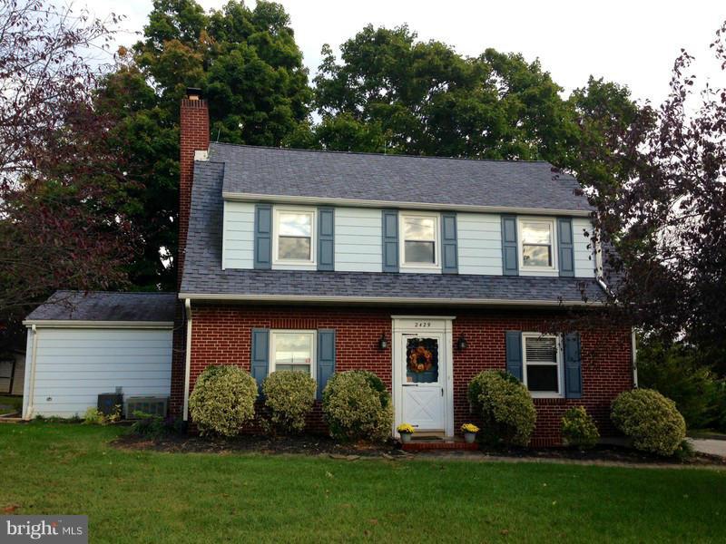 2429 Baldwin Mill Road Baldwin, MD 21013 - Photo 1 of 30 a front view of a house with a yard and plants