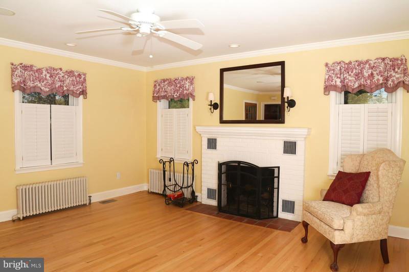 2429 Baldwin Mill Road Baldwin, MD 21013 - Photo 13 of 30 a living room with furniture and a fireplace