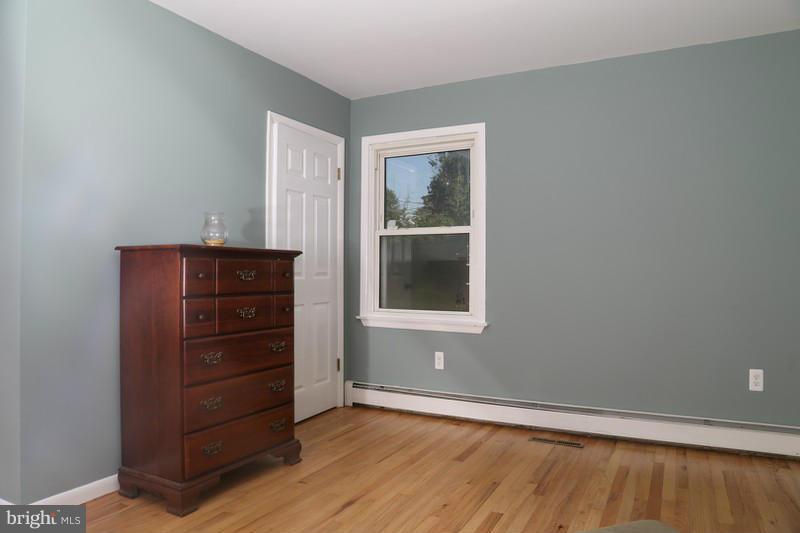2429 Baldwin Mill Road Baldwin, MD 21013 - Photo 14 of 30 a view of an empty room with wooden floor and a window