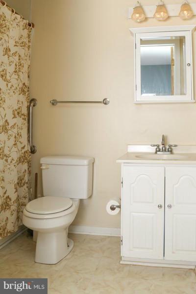 2429 Baldwin Mill Road Baldwin, MD 21013 - Photo 15 of 30 a bathroom with a sink a toilet and mirror
