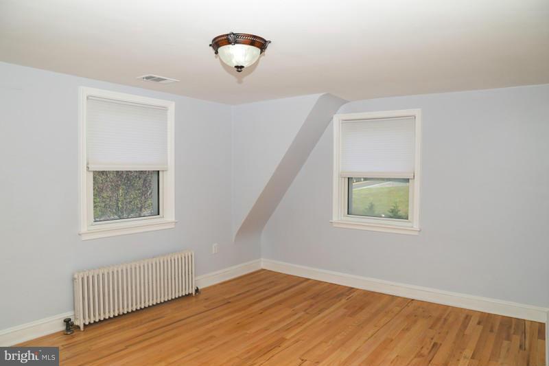 2429 Baldwin Mill Road Baldwin, MD 21013 - Photo 30 of 30 a view of an empty room with a window and wooden floor