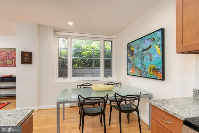 a view of a dining room with furniture and a window
