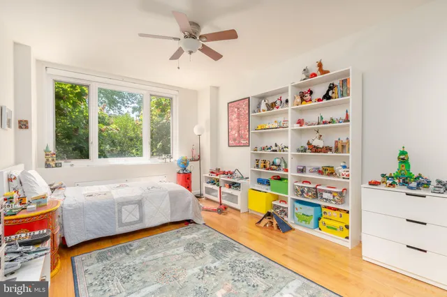 a bed room with a bed and a window