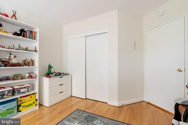 a room with toys and dresser