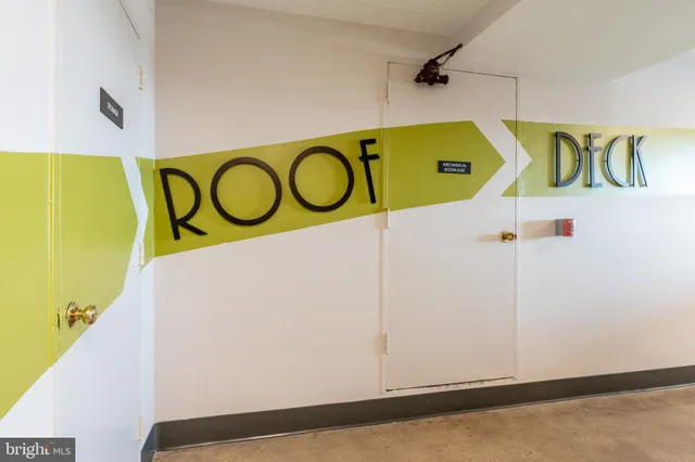 a sign that is on top of a wall