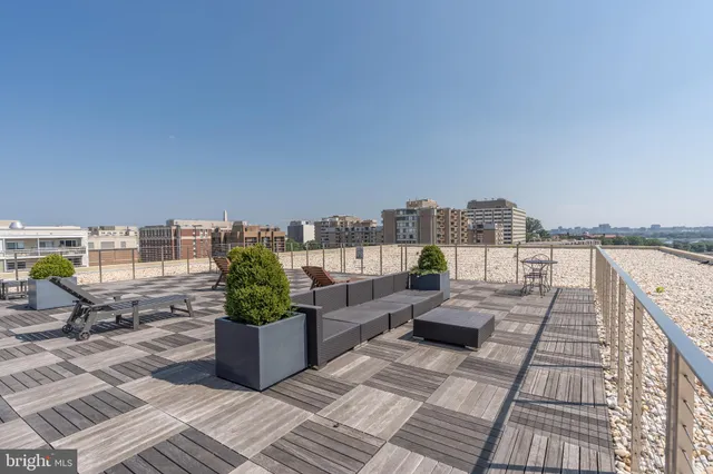 a view of roof deck with patio