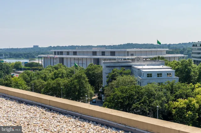 a view of a large building with a yard