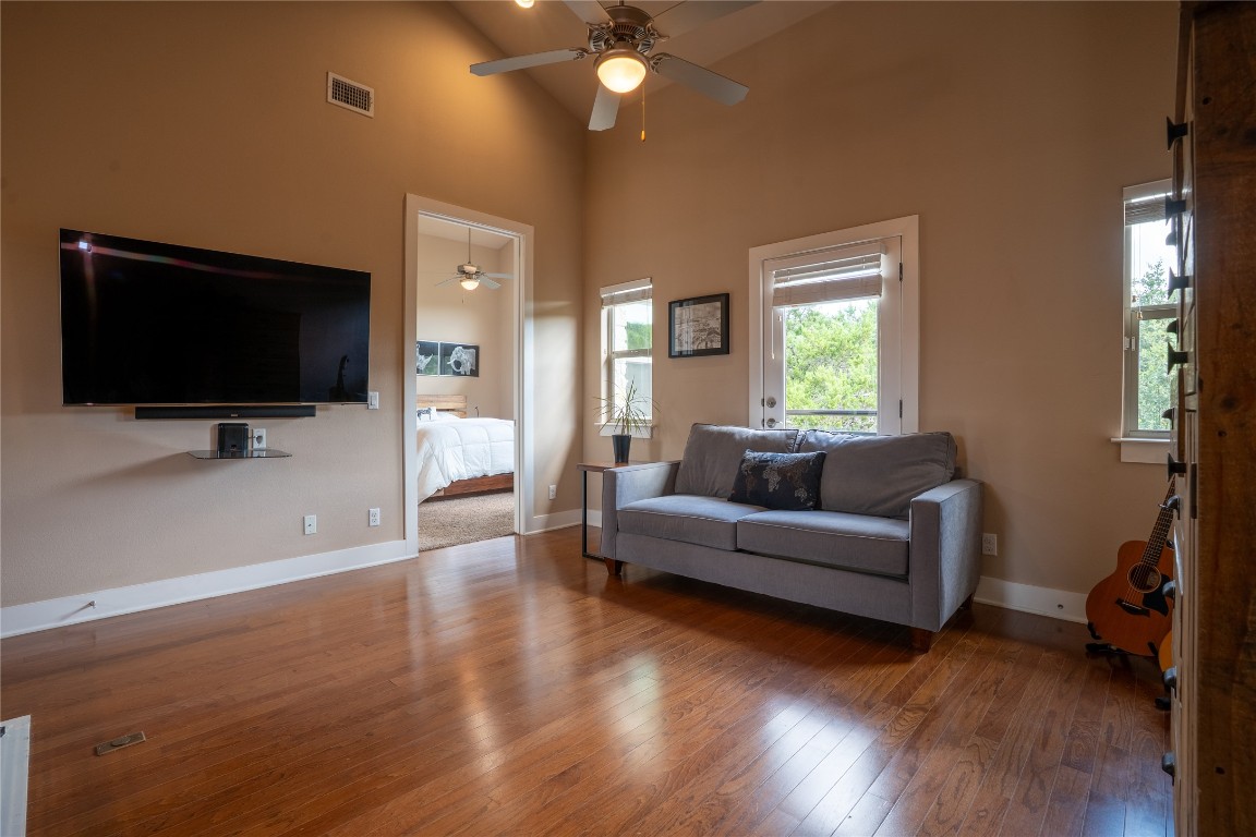 8110 Ranch Road 2222, Unit 45 Austin, TX 78730 - Photo 15 of 38 a living room with furniture and a flat screen tv