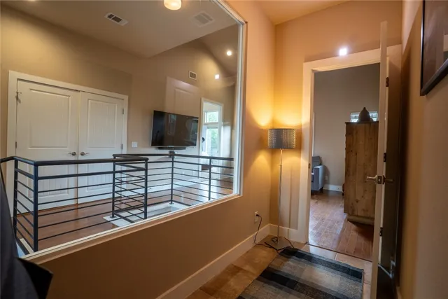 a view of a hallway with seating area