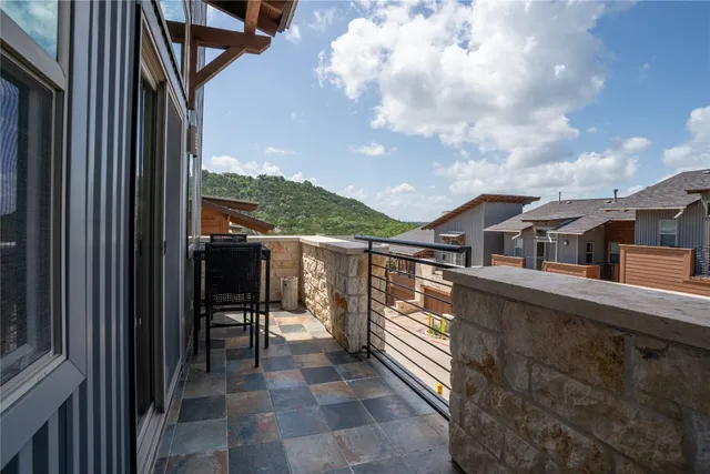 a bathroom with a granite countertop sink toilet and a mirror