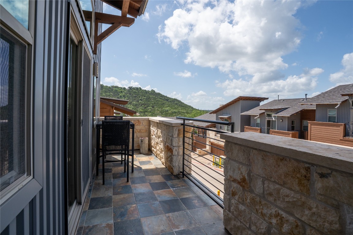 8110 Ranch Road 2222, Unit 45 Austin, TX 78730 - Photo 22 of 38 a balcony view with two chairs and a table