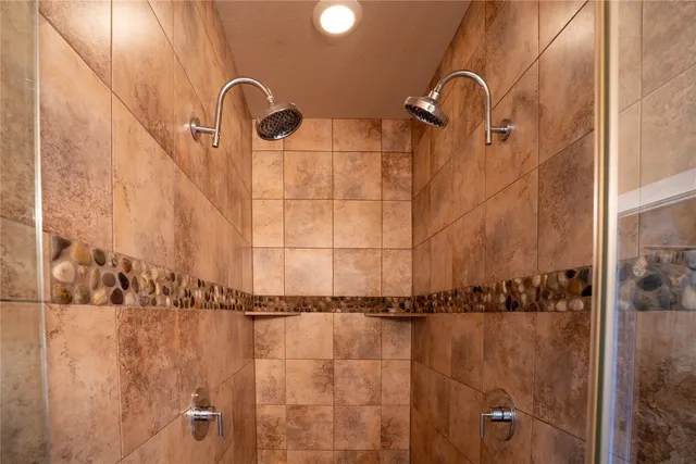 a en suite bathroom with a sink and a mirror