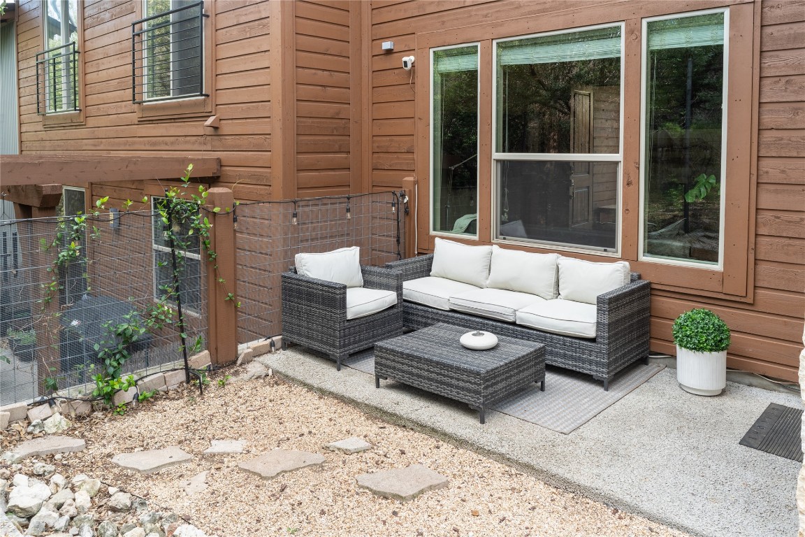 8110 Ranch Road 2222, Unit 45 Austin, TX 78730 - Photo 32 of 38 a view of a patio with couches and a potted plant