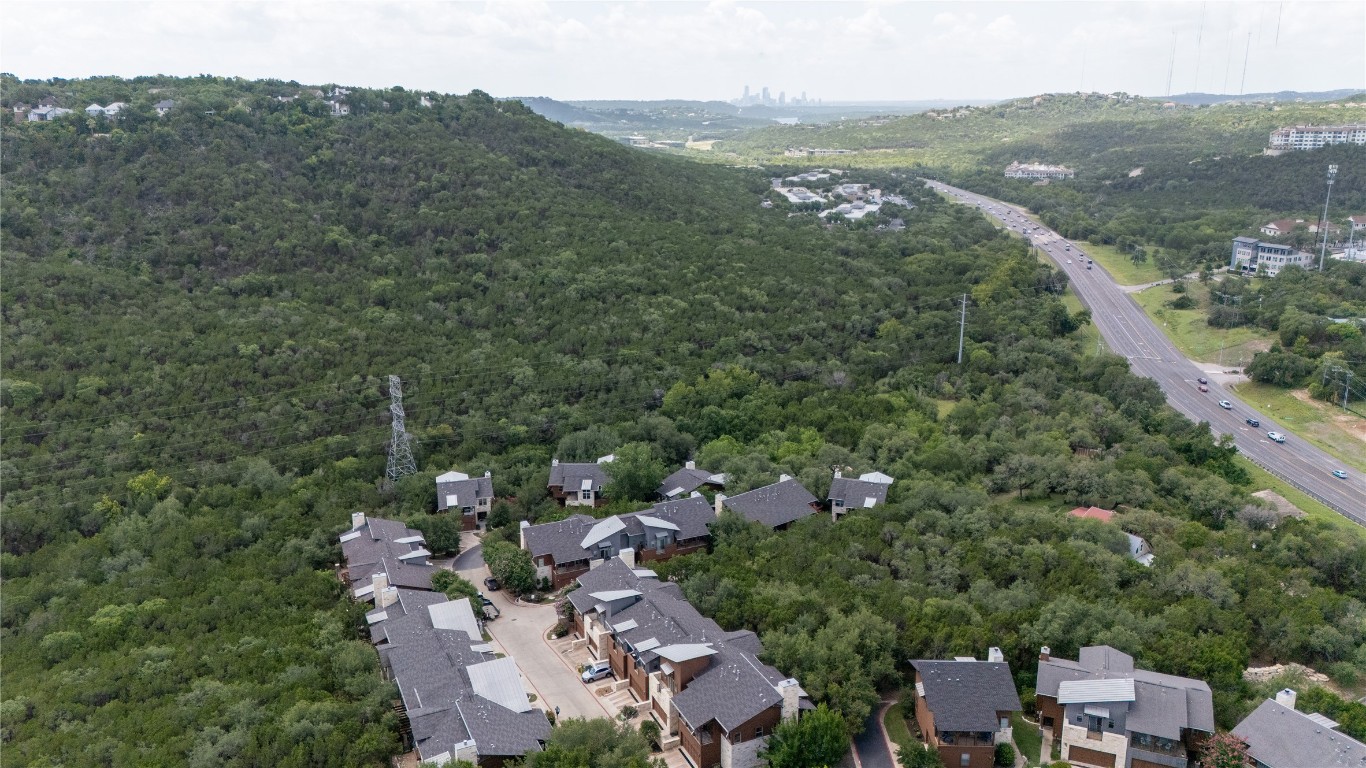 8110 Ranch Road 2222, Unit 45 Austin, TX 78730 - Photo 34 of 38 an aerial view of residential houses with outdoor space and trees