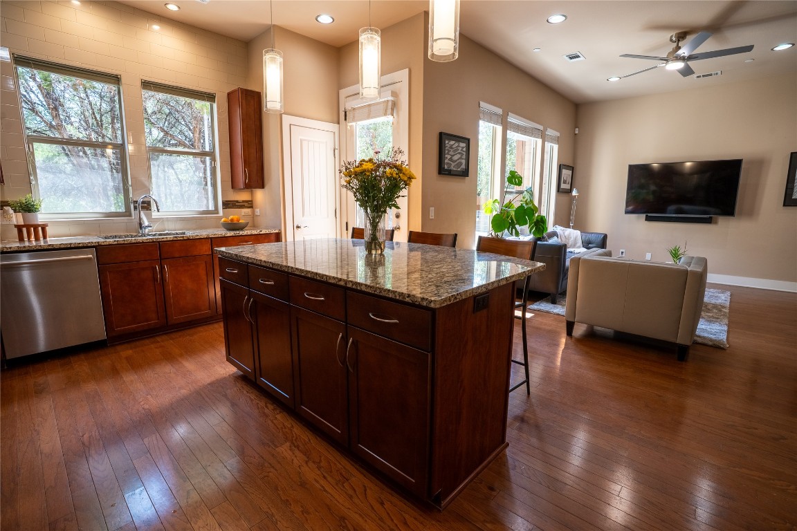 8110 Ranch Road 2222, Unit 45 Austin, TX 78730 - Photo 38 of 38 a kitchen with stainless steel appliances granite countertop wooden cabinets and sink