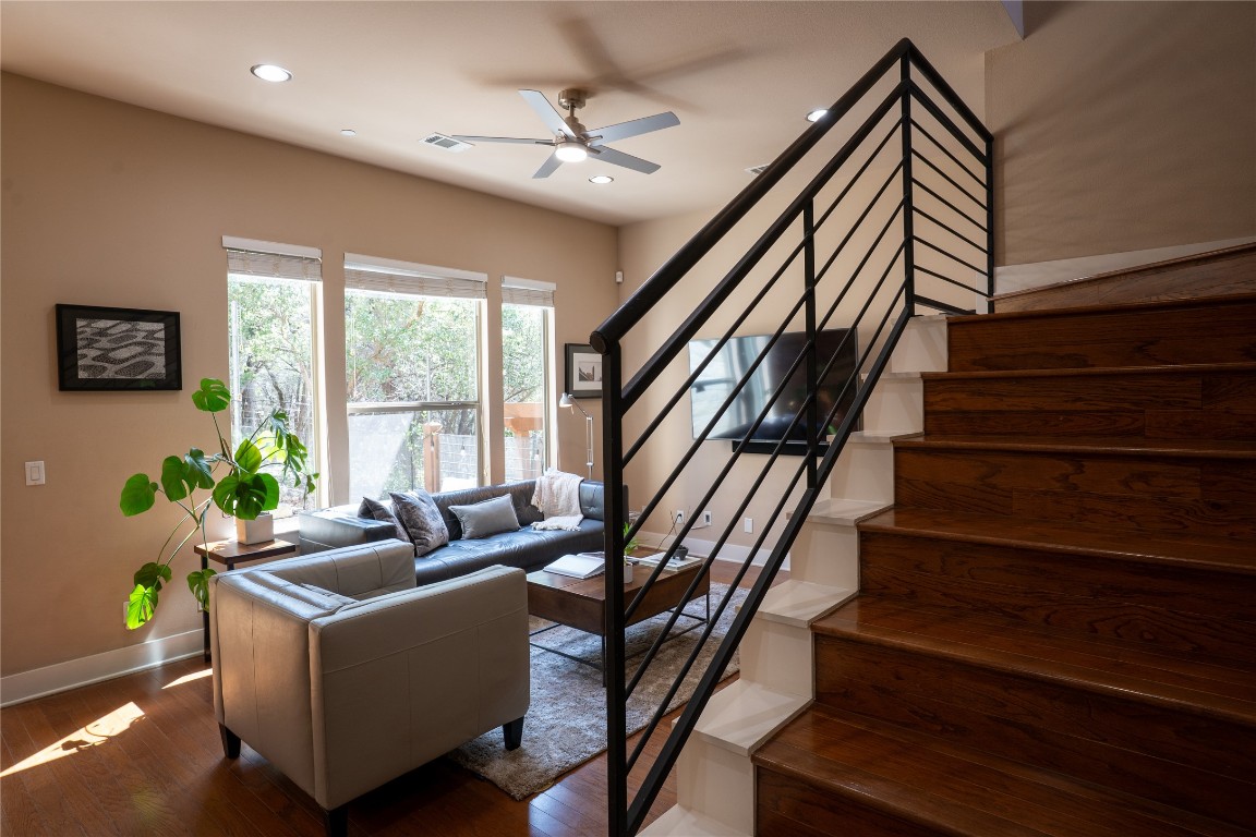 8110 Ranch Road 2222, Unit 45 Austin, TX 78730 - Photo 7 of 38 a living room with wooden floor furniture and a ceiling fan