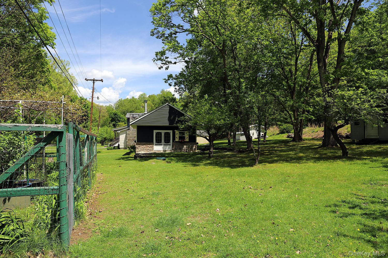 860 River Road Callicoon, NY 12723 - Photo 26 of 45 a front view of a house with garden