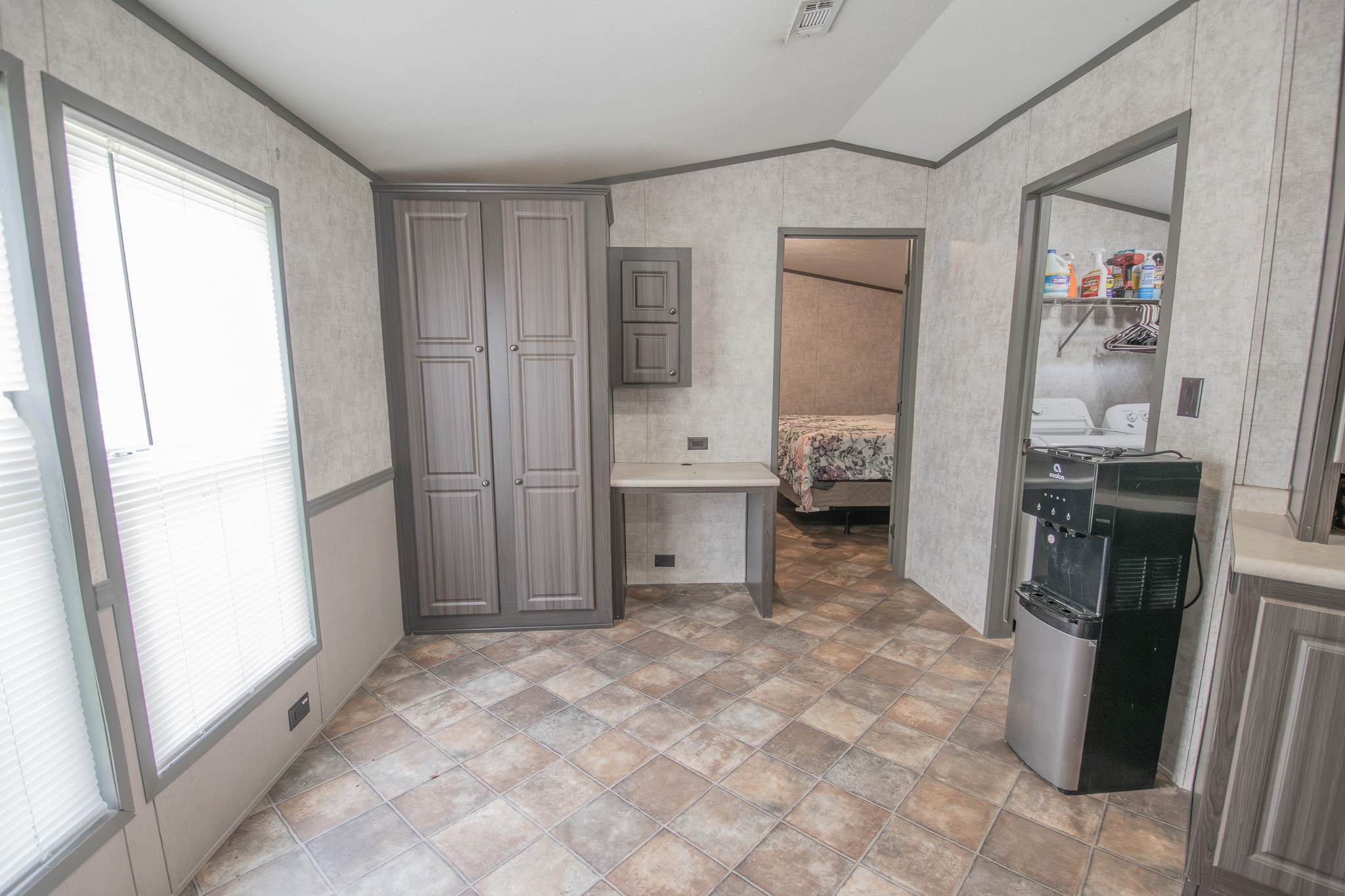2801 County Road 444 Angleton, TX 77515 - Photo 12 of 37 a bedroom with a bed and a window