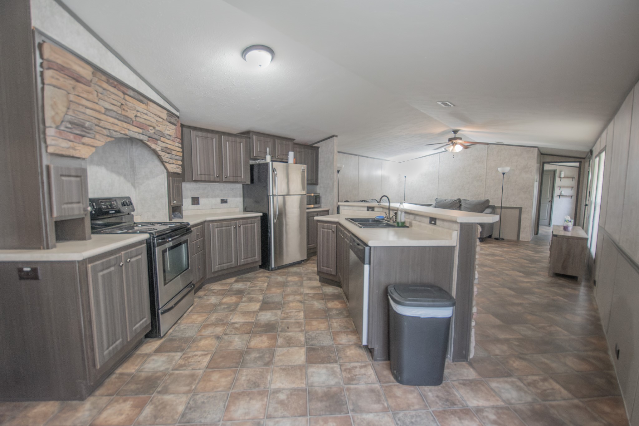 2801 County Road 444 Angleton, TX 77515 - Photo 12 of 38 a kitchen with a sink a stove and cabinets