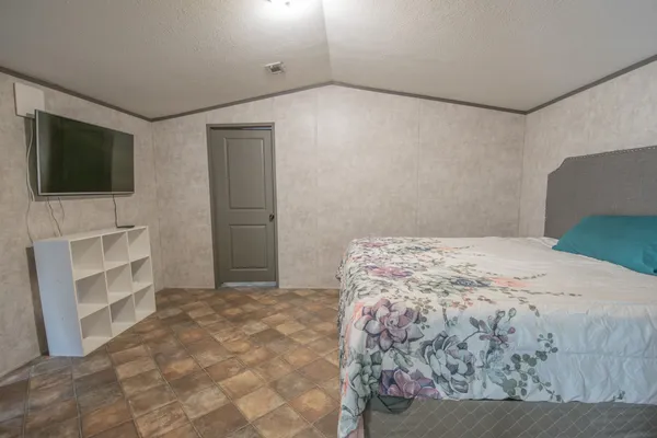 a bedroom with a bed and a cabinets